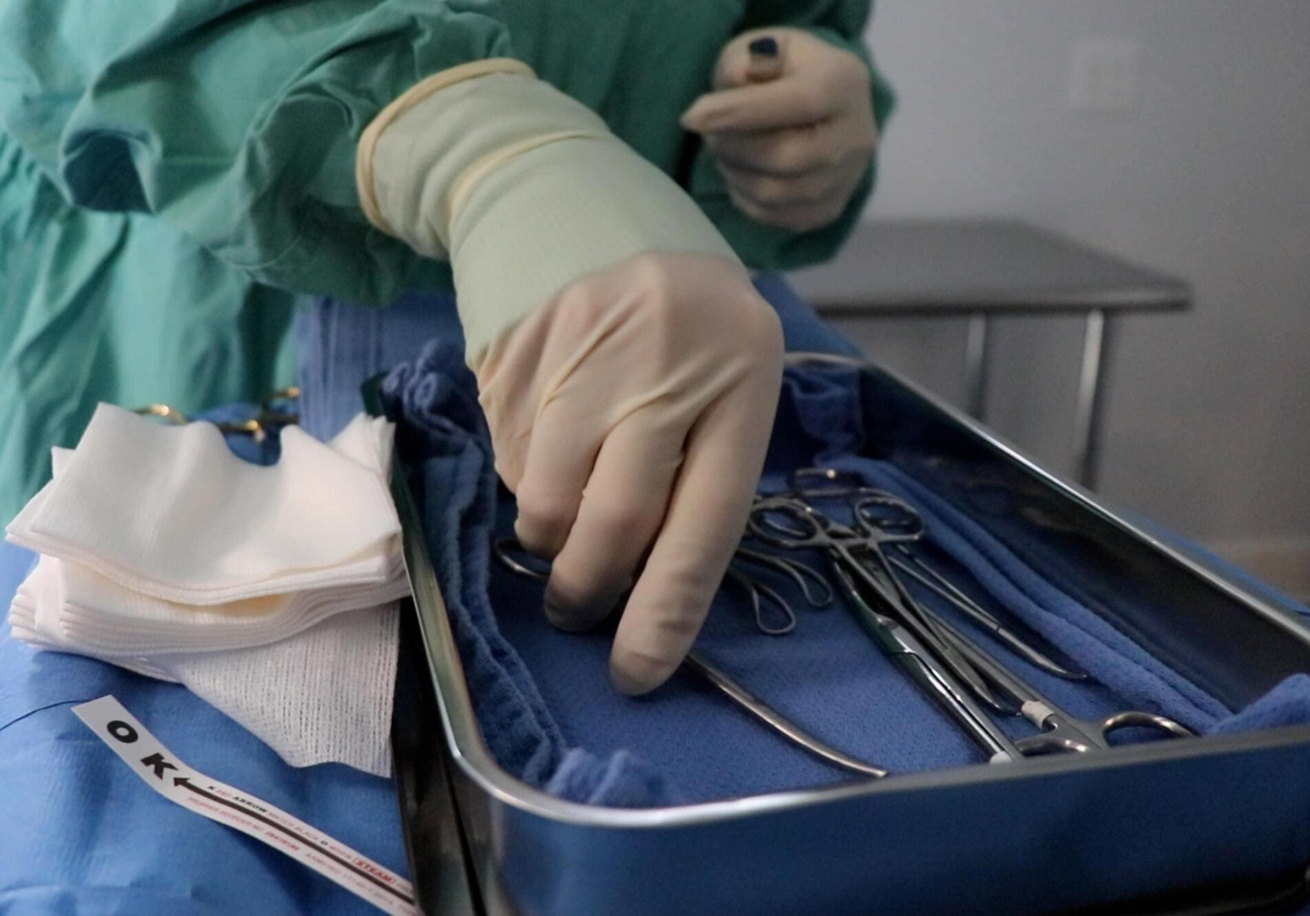 Close Up Of Doctor Grabbing Surgical Equipment